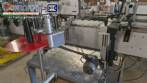 Etiquetadora autom�tica de doble cabezal para botellas planas Bauch Campos