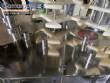 Llenadora rotativa gravimtrica de acero inoxidable con cabina