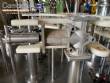 Llenadora rotativa gravimtrica de acero inoxidable con cabina