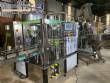 Llenadora rotativa gravim�trica de acero inoxidable con cabina