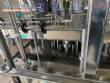 Llenadora rotativa gravim�trica de acero inoxidable con cabina