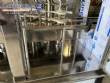 Llenadora rotativa gravim�trica de acero inoxidable con cabina