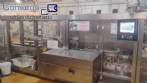 Encartonadora horizontal de acero inoxidable Fabrima con encoladora Nordson